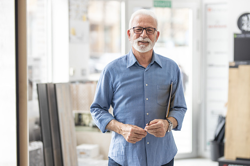 Portrait of senior design studio worker .